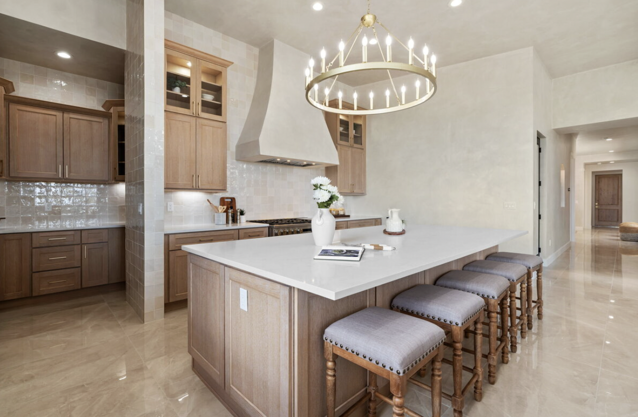 kitchen island with large round lighting on ceiling